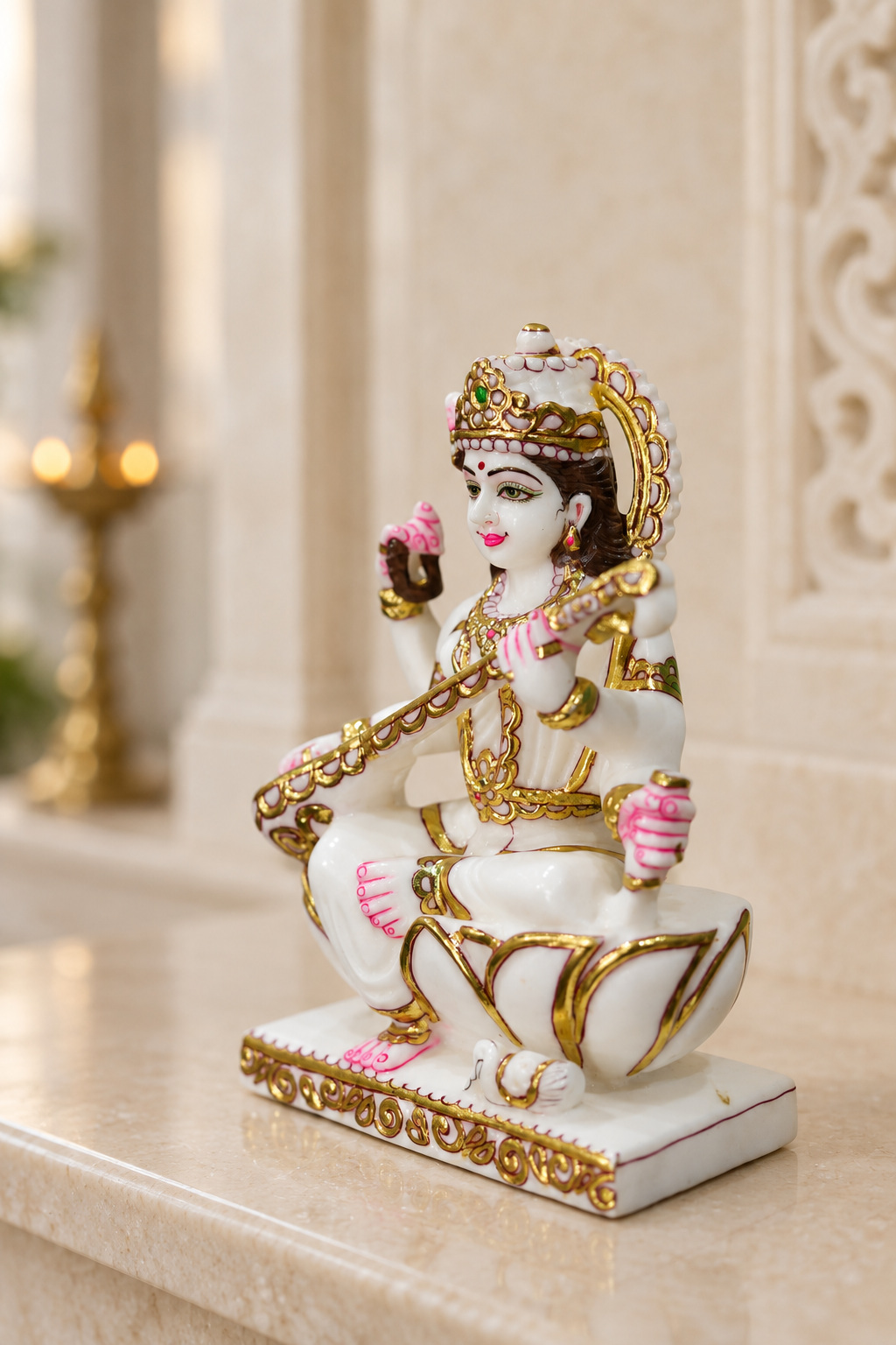 Complete marble Saraswati murti with veena, viewed from an angle